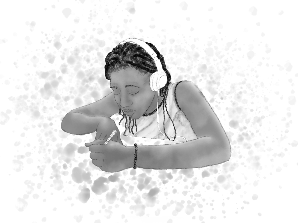 Teenage Black girl with headphones on sitting at a desk and writing